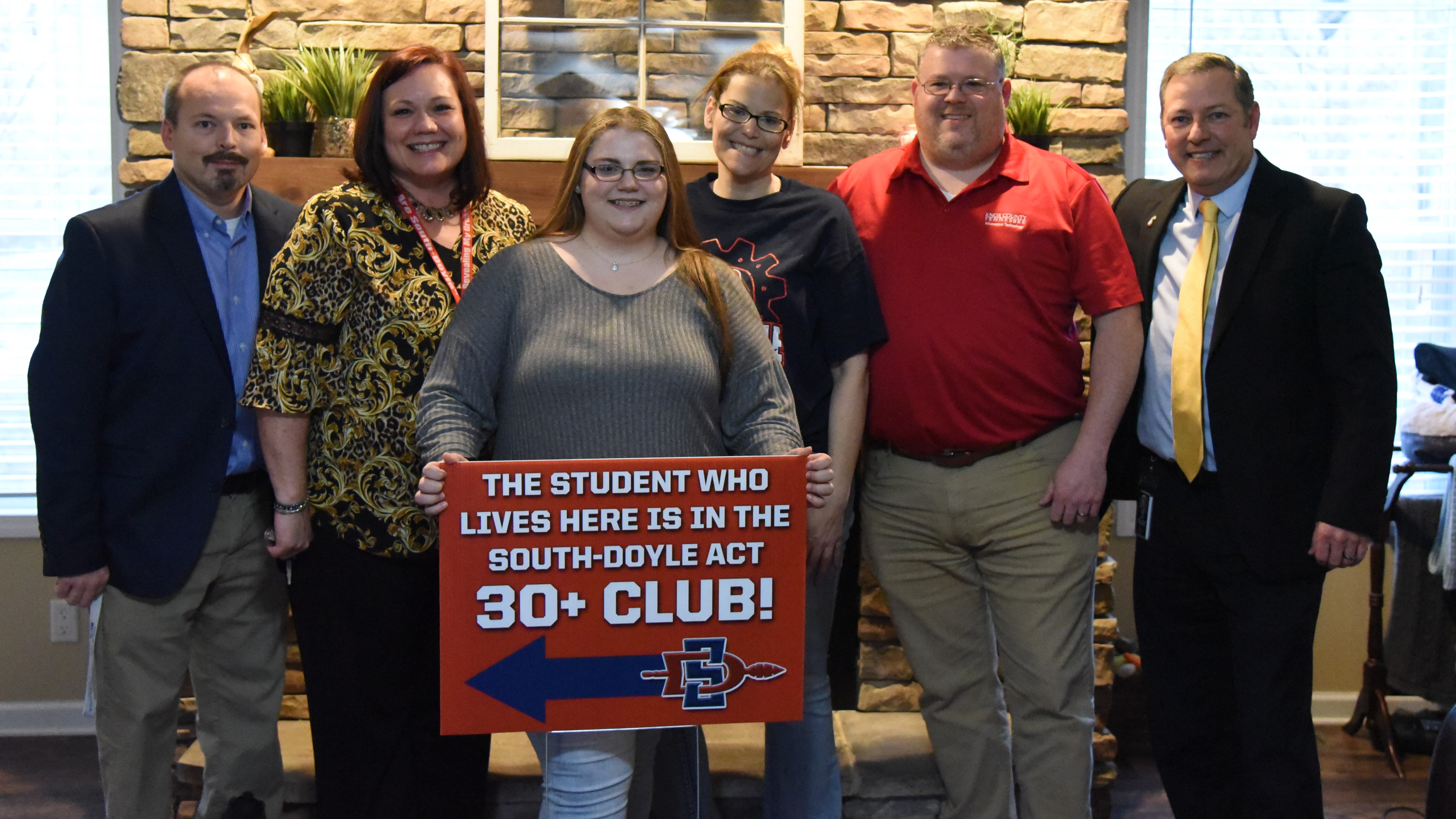 South-Doyle High School junior Kailey Garrison (holding sign) celebrates her induction into the school's ACT South-Doyle High School junior Kailey Garrison (holding sign) celebrates her induction into the school's ACT