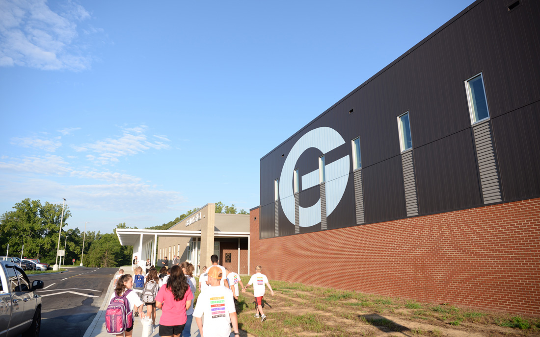 Students walking into Gibbs Middle School on the first day of school. 