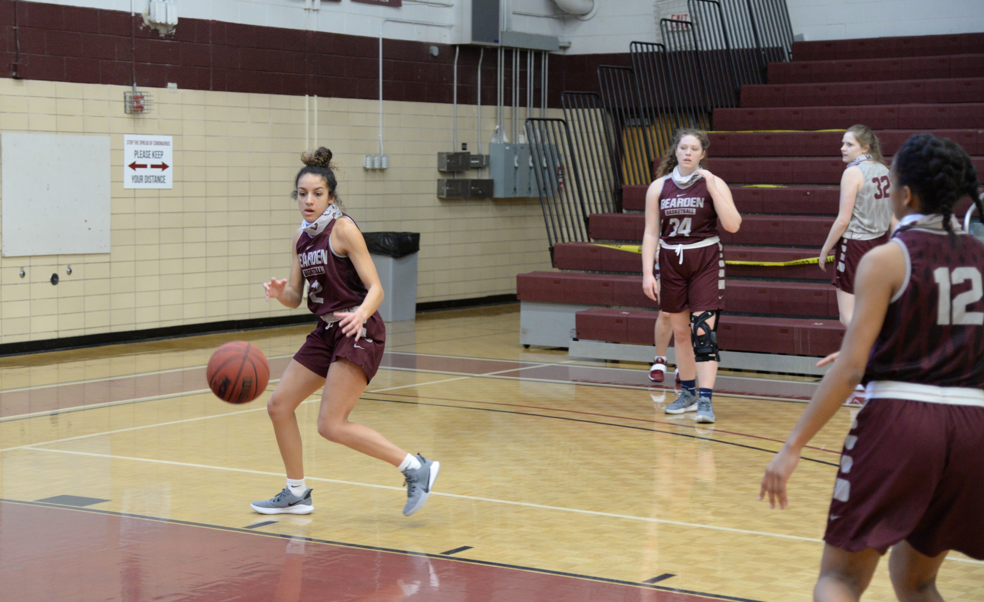 Reagan Ruth (left) prepares to shoot a layup as Natalie Rice (#34) looks on. Ruth and Rice, along with Zneyah McLaughlin (#12) are senior captains of a Bulldog team that won the 2-AAA region tournament on March 3..