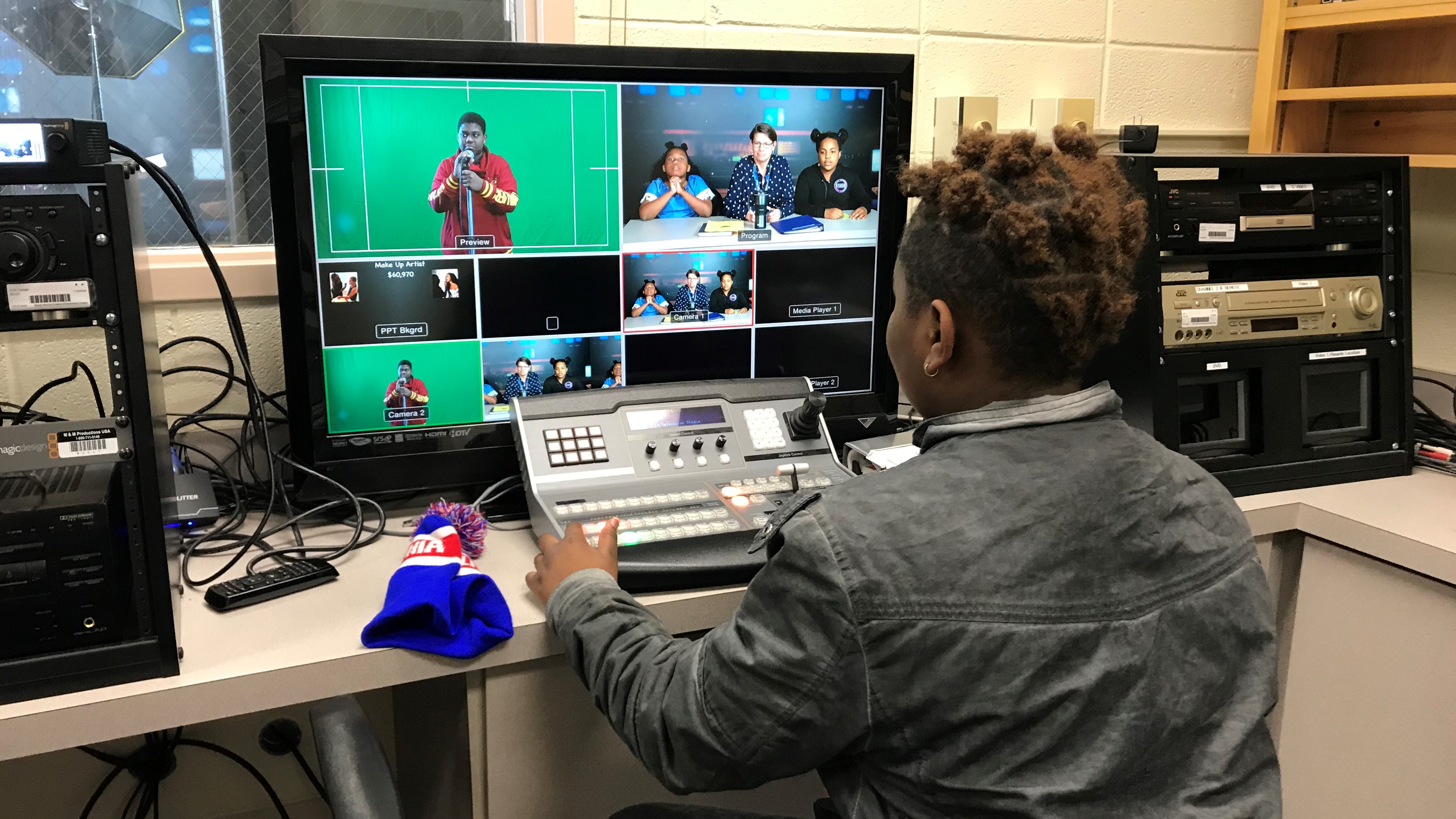 Tylee Jackson operates a switcher during the morning news broadcast at Sarah Moore Greene Magnet Academy. 