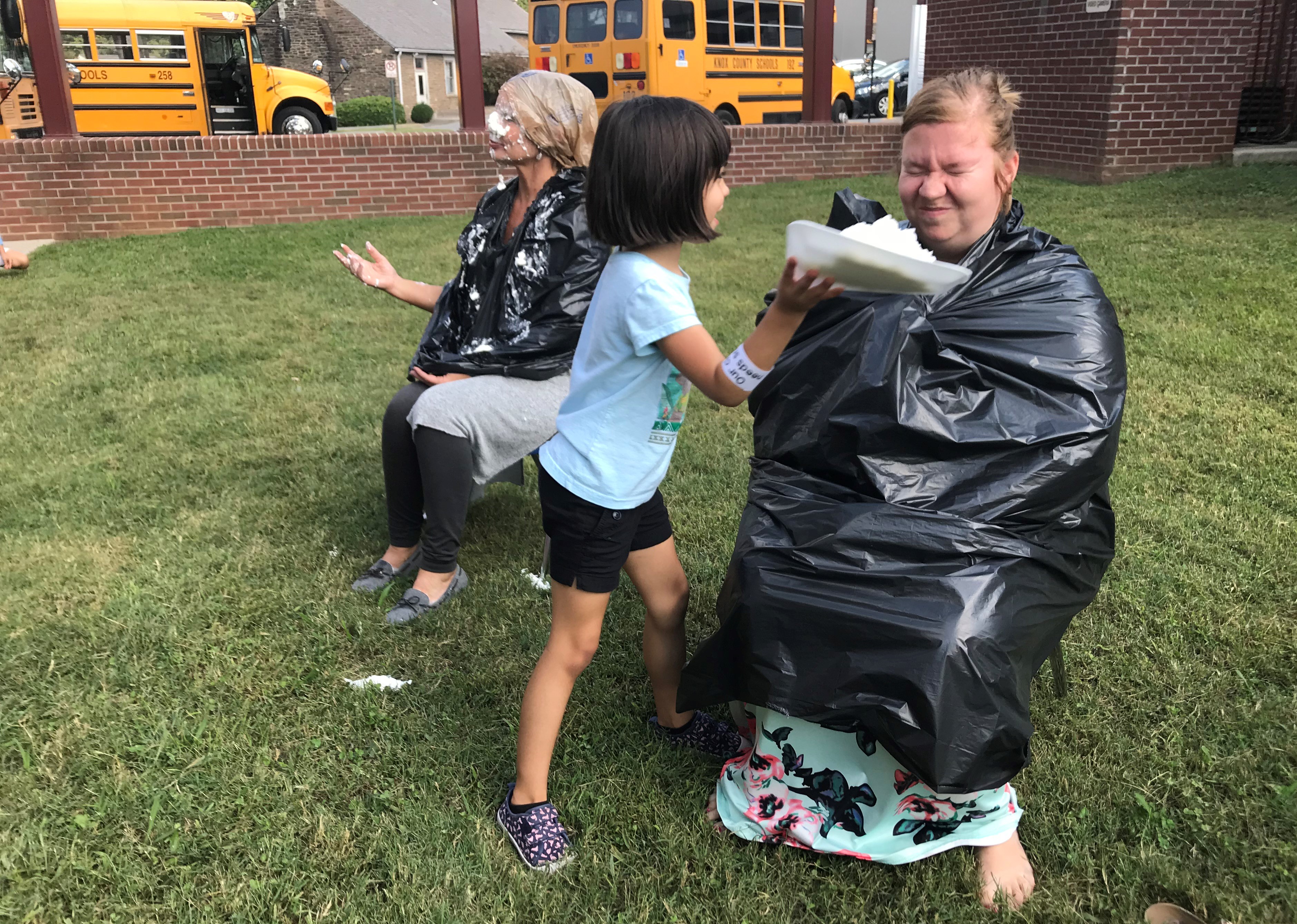Teachers and administrators at Adrian Burnett Elementary School get 