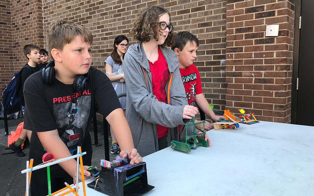 Cody Collette, a 7th grader at South-Doyle Middle School, prepares to launch a mousetrap-powered catapult. 