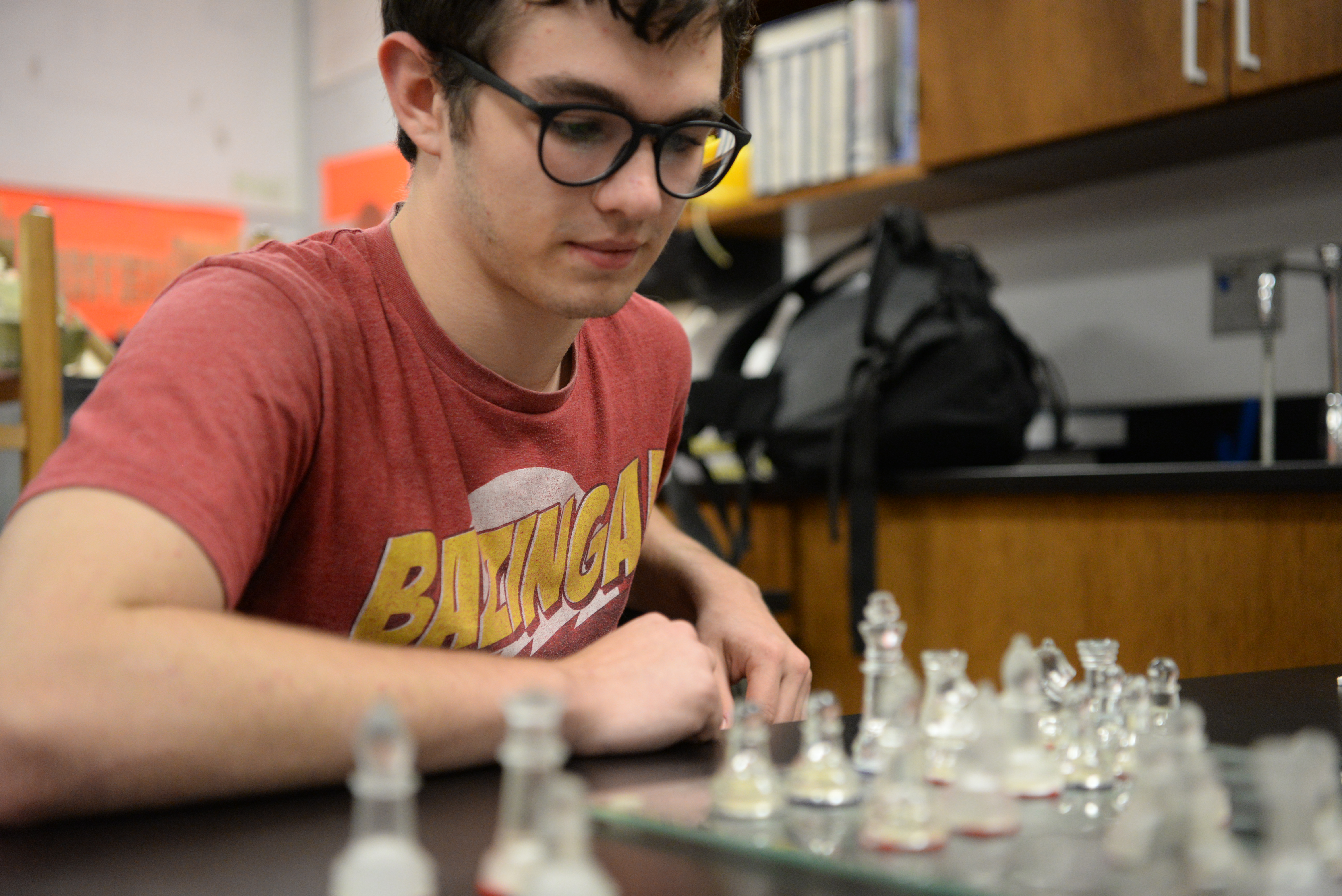 Jesse Mullins, president of the Bearden High School Chess Club, reviews the board during a recent match. 
