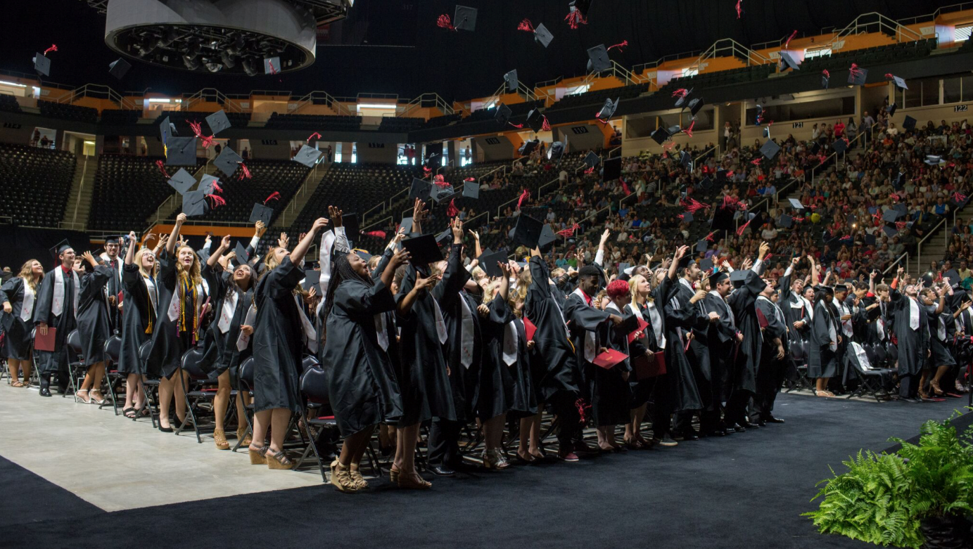 Students celebrate graduation at Thompson-Boling Arena. 