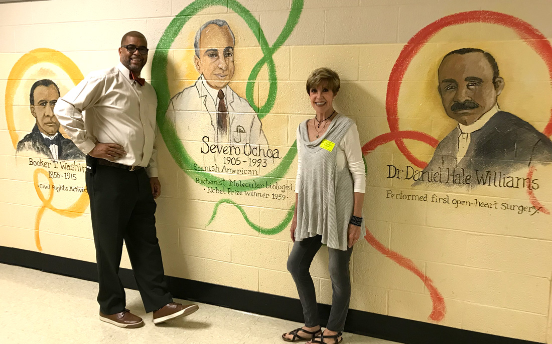 Clarence Swearengen, campus manager and athletic director at Vine Middle Magnet School, and artist Gale Hinton.
