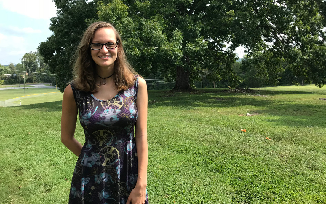 Former Carter High School student Kendra Craig stands in front of the Carter library