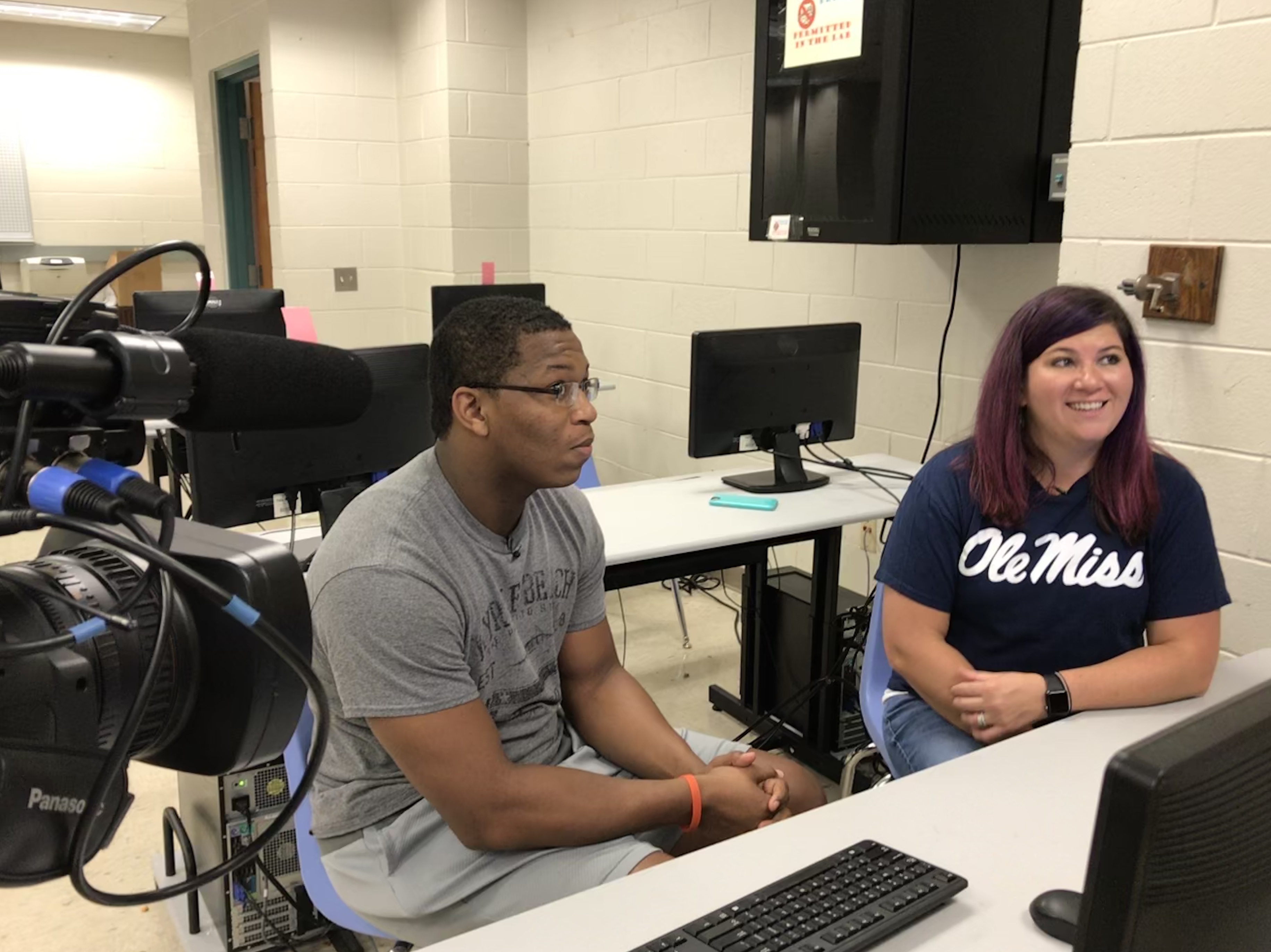 Austin-East senior LeMichael Moulden and counselor Amanda Martin sit in the computer lab on September 18, 2018. 