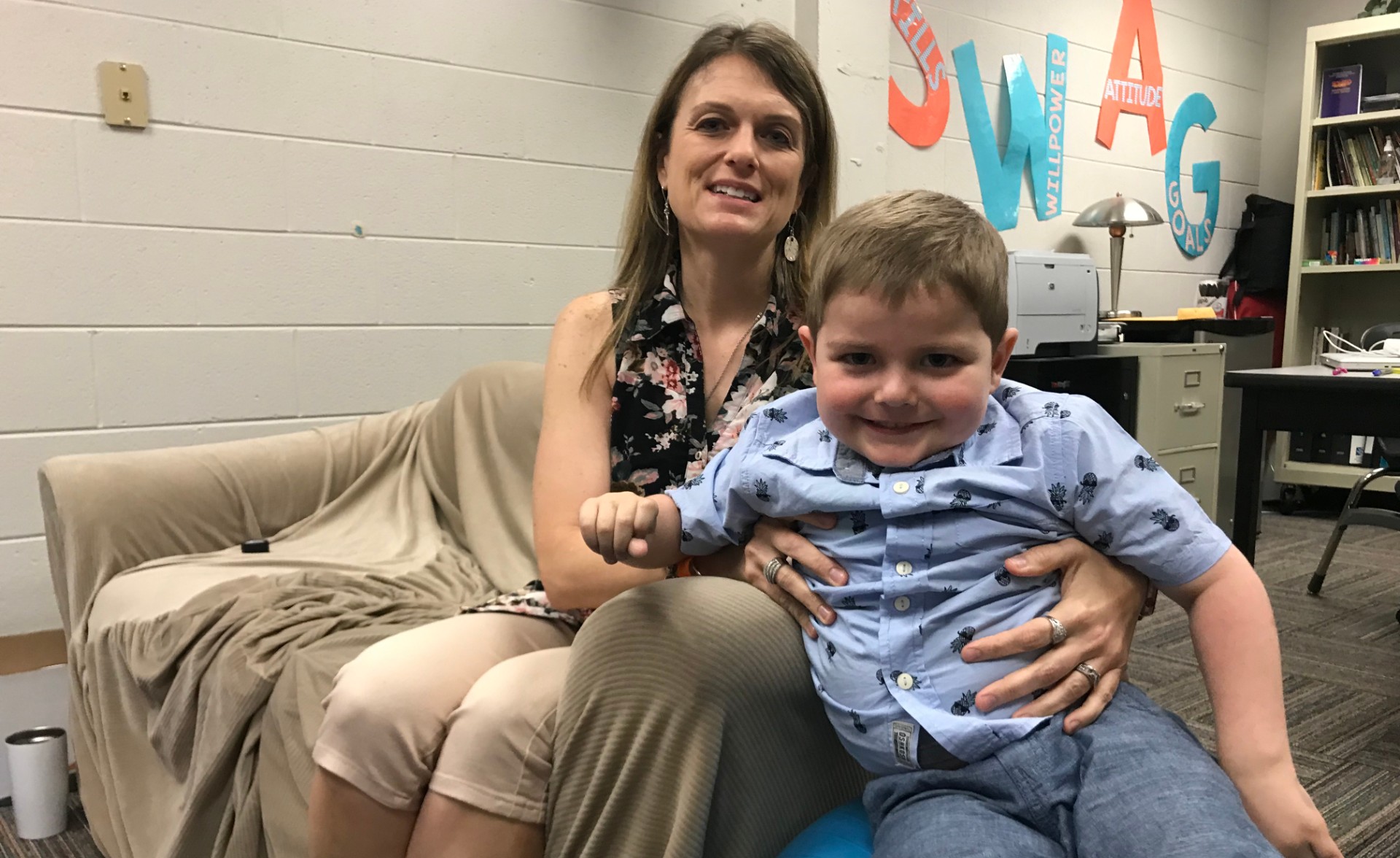 Martha Sileno and her son, Noah, sit at Holston Middle School. 