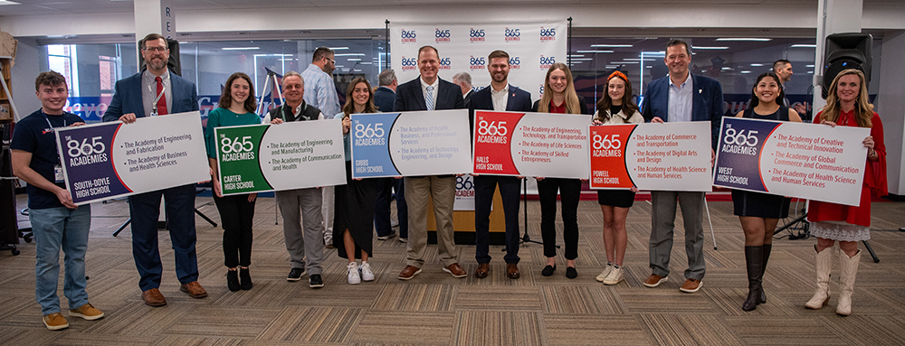 Students and Principals Pose with their Academy Posters