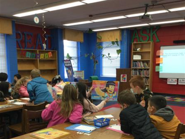 Students looking at a book