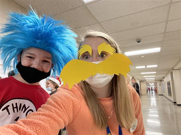 thing one and the lorax pose for a picture
